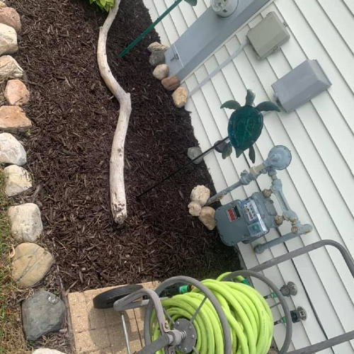 Landscaping image with garden hose