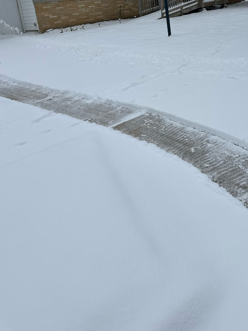 An image of a snow plowed sidewalk